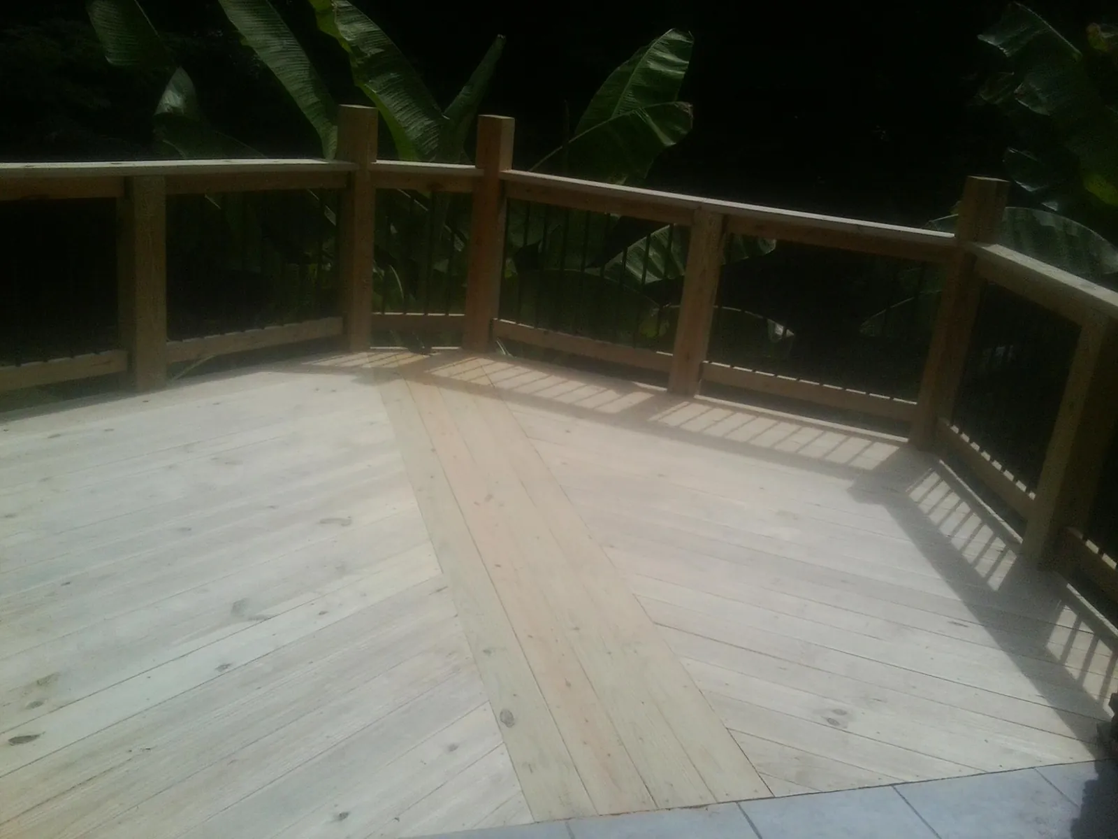 New wood deck and railing built off the back of a home in Hardwick